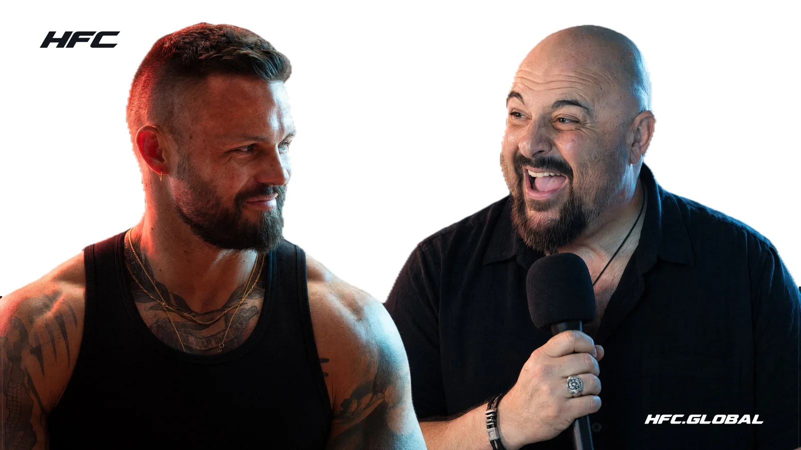 HFC I commentators Michael Schiavello and Sandor Earl, laughing together, one holding a microphone
